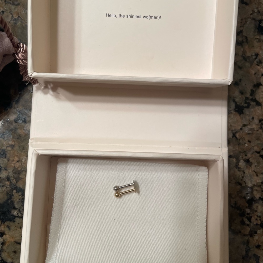 14k gold and white gold cartilage earrings.